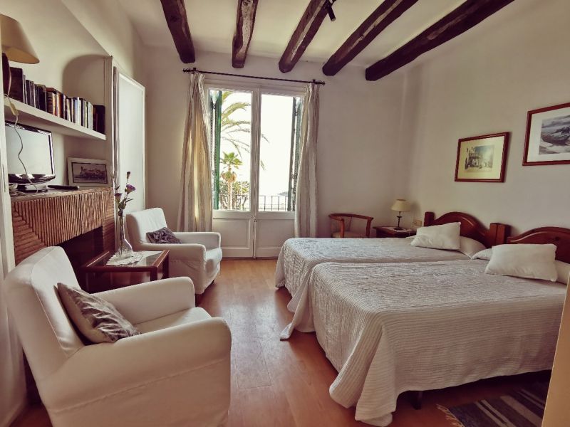 The bedroom of a tourist accommodation in Sitges